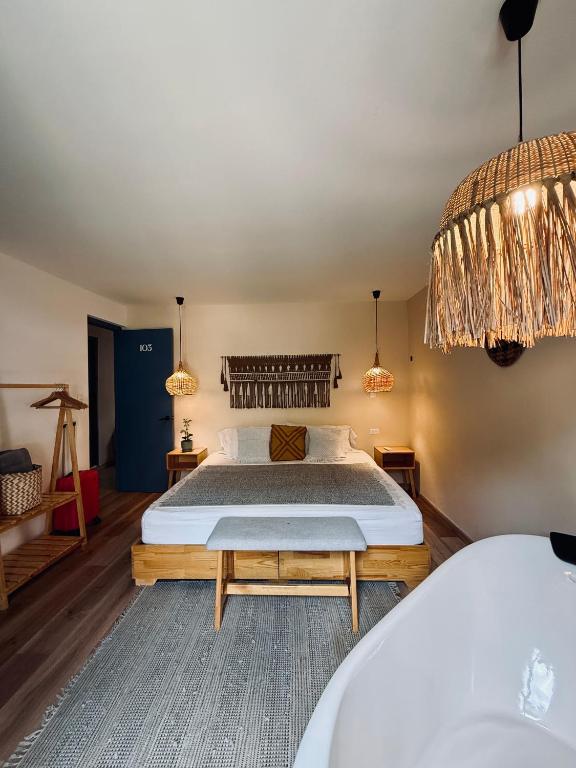 Postel nebo postele na pokoji v ubytování Poblado Luum Boutique hotel