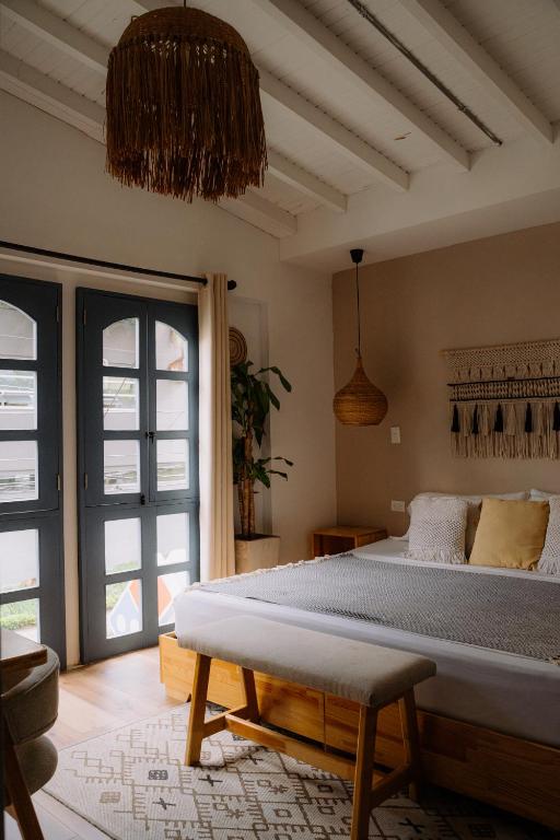 Postel nebo postele na pokoji v ubytování Poblado Luum Boutique hotel