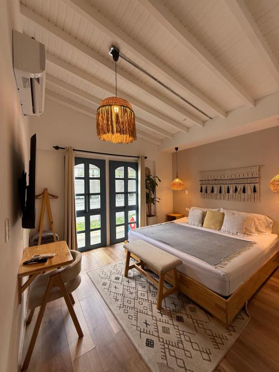 Postel nebo postele na pokoji v ubytování Poblado Luum Boutique hotel