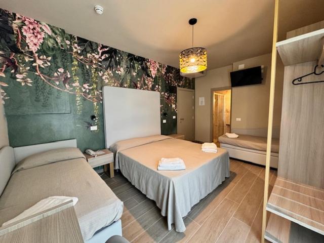 Postel nebo postele na pokoji v ubytování Hotel Royal Inn
