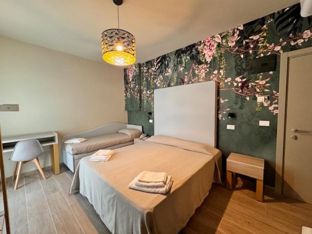 Postel nebo postele na pokoji v ubytování Hotel Royal Inn