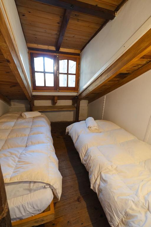 Postel nebo postele na pokoji v ubytování Cabañas La Oma Intiyaco