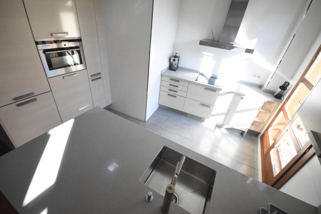 Kuchyň nebo kuchyňský kout v ubytování Bello Apartamento en la Plaza del Tossal