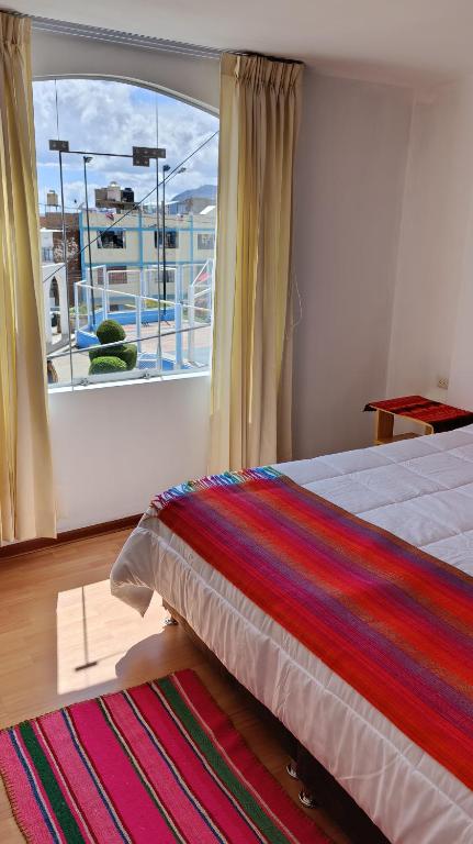 Postel nebo postele na pokoji v ubytování kuntur inn hotel