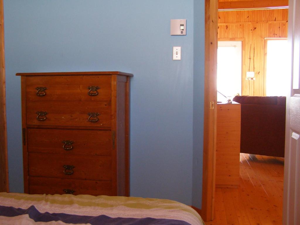 Postel nebo postele na pokoji v ubytování Les Chalets Brise-de-Mer