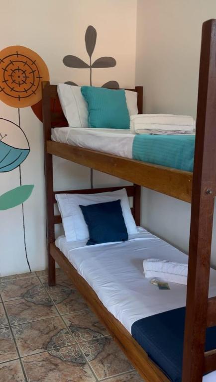 Postel nebo postele na pokoji v ubytování Cacau Biruta