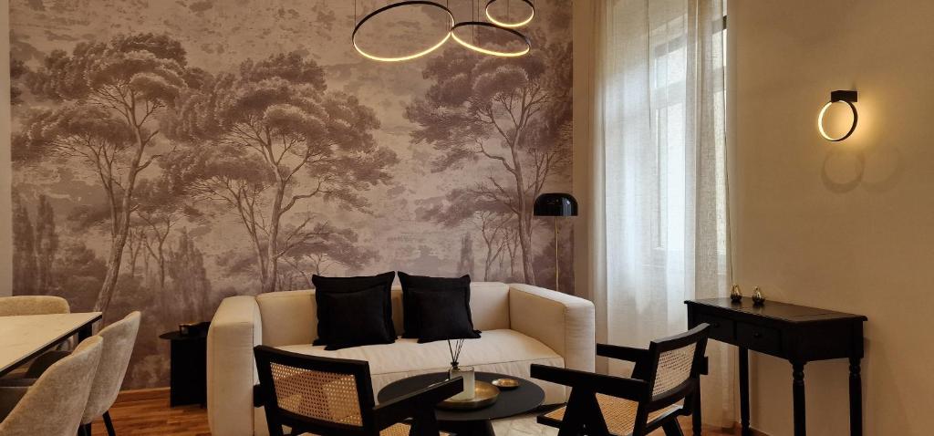 a living room with a couch and a wall mural at Mystique Apartment in Opatija