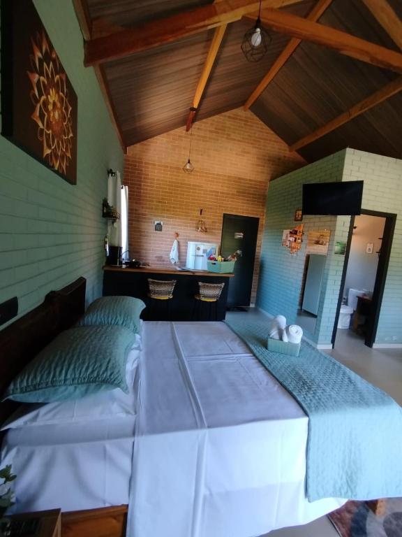 Postel nebo postele na pokoji v ubytování REFUGIO PIEMONTE Chalés