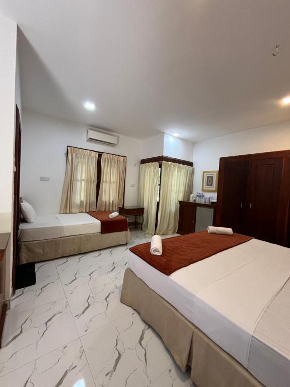 Postel nebo postele na pokoji v ubytování Hotel 4 U Saliya Garden