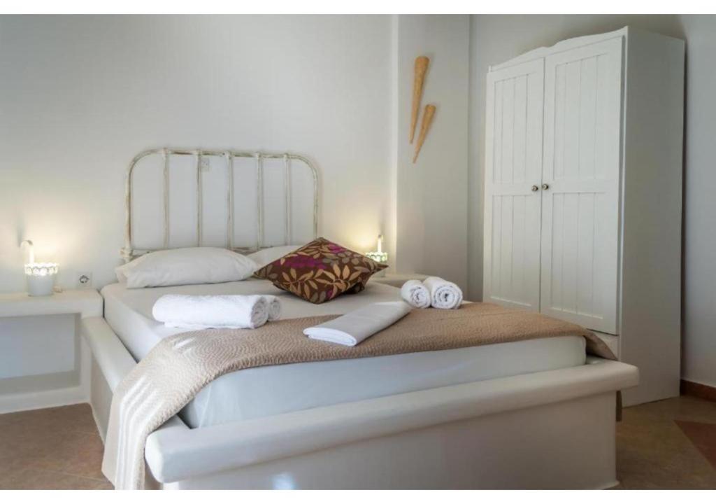 Postel nebo postele na pokoji v ubytování Oceanis Rooms