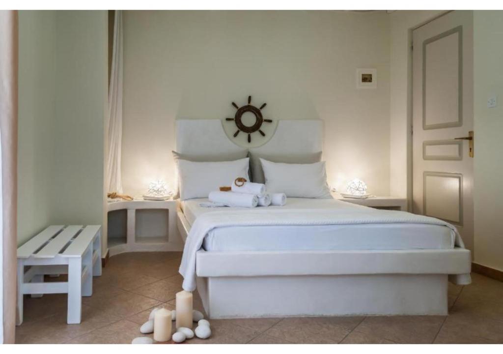 Postel nebo postele na pokoji v ubytování Oceanis Rooms