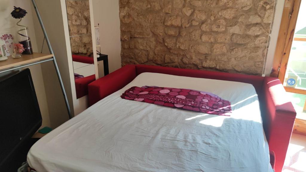 A bed or beds in a room at apartemento rural