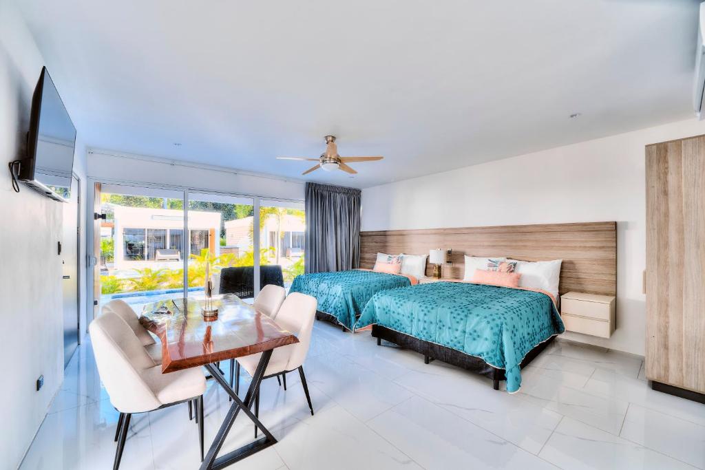 Postel nebo postele na pokoji v ubytování Villas Ríos del Caribe