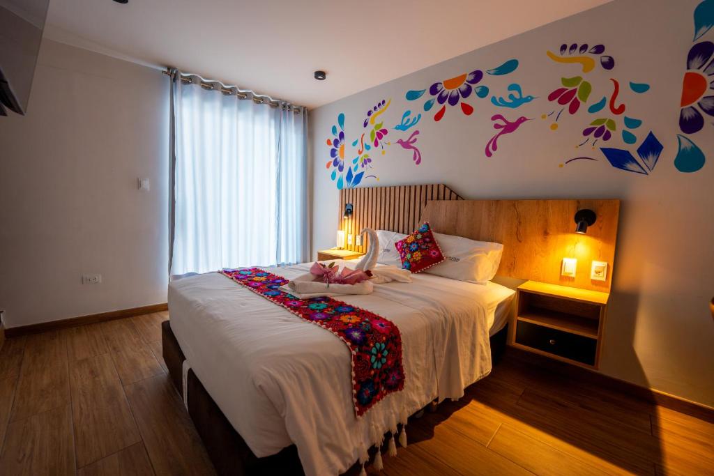 Postel nebo postele na pokoji v ubytování Platero Hotel
