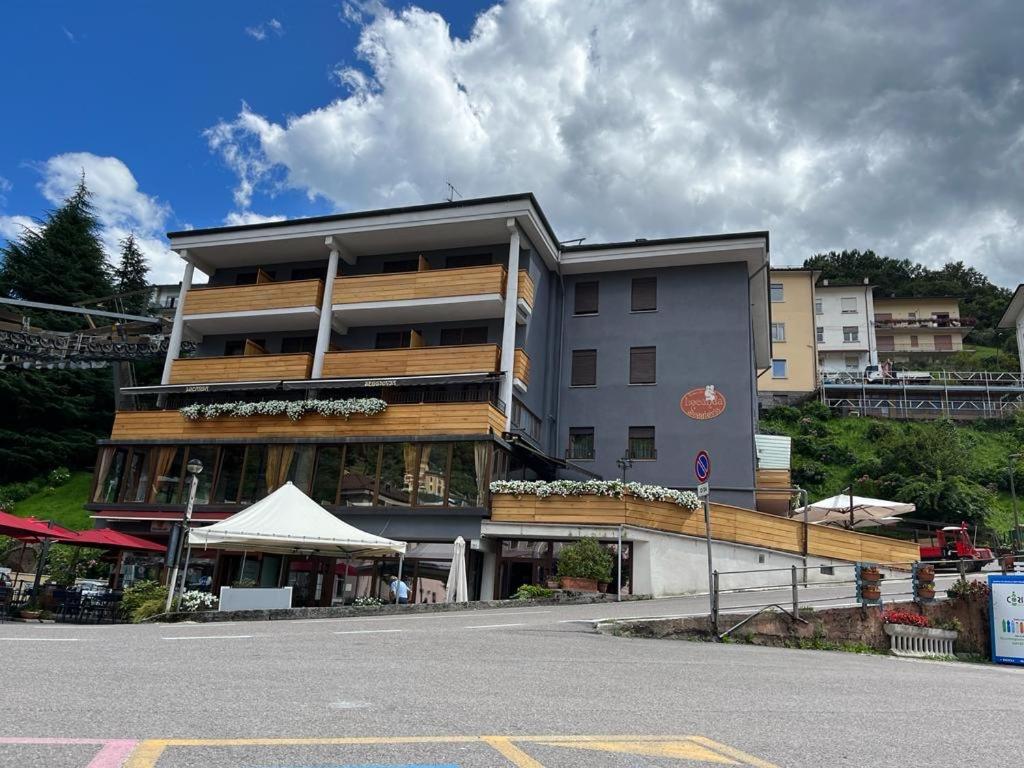 a large building on the side of a street at Locanda Seggiovia in Recoaro Terme
