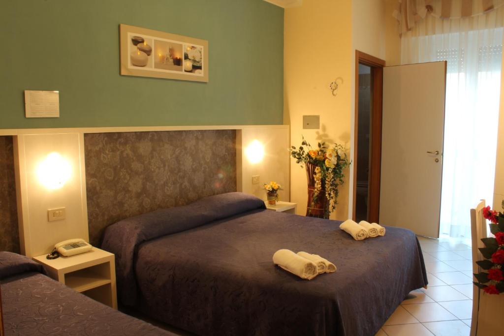 Postel nebo postele na pokoji v ubytování Hotel Senyor