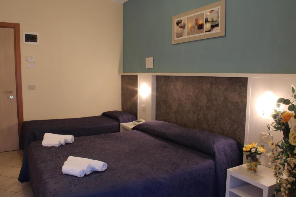 Postel nebo postele na pokoji v ubytování Hotel Senyor