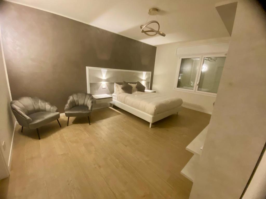 Ένα ή περισσότερα κρεβάτια σε δωμάτιο στο LA Maison