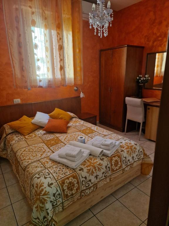 Postel nebo postele na pokoji v ubytování Spiagge Iblee