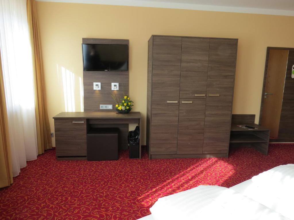 Postel nebo postele na pokoji v ubytování ates Hotel Lampertheim by AURUM
