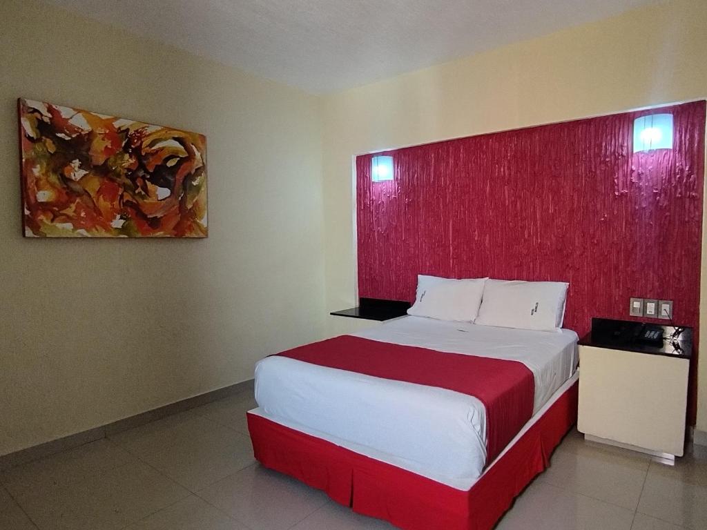 Postel nebo postele na pokoji v ubytování HOTEL MORELOS
