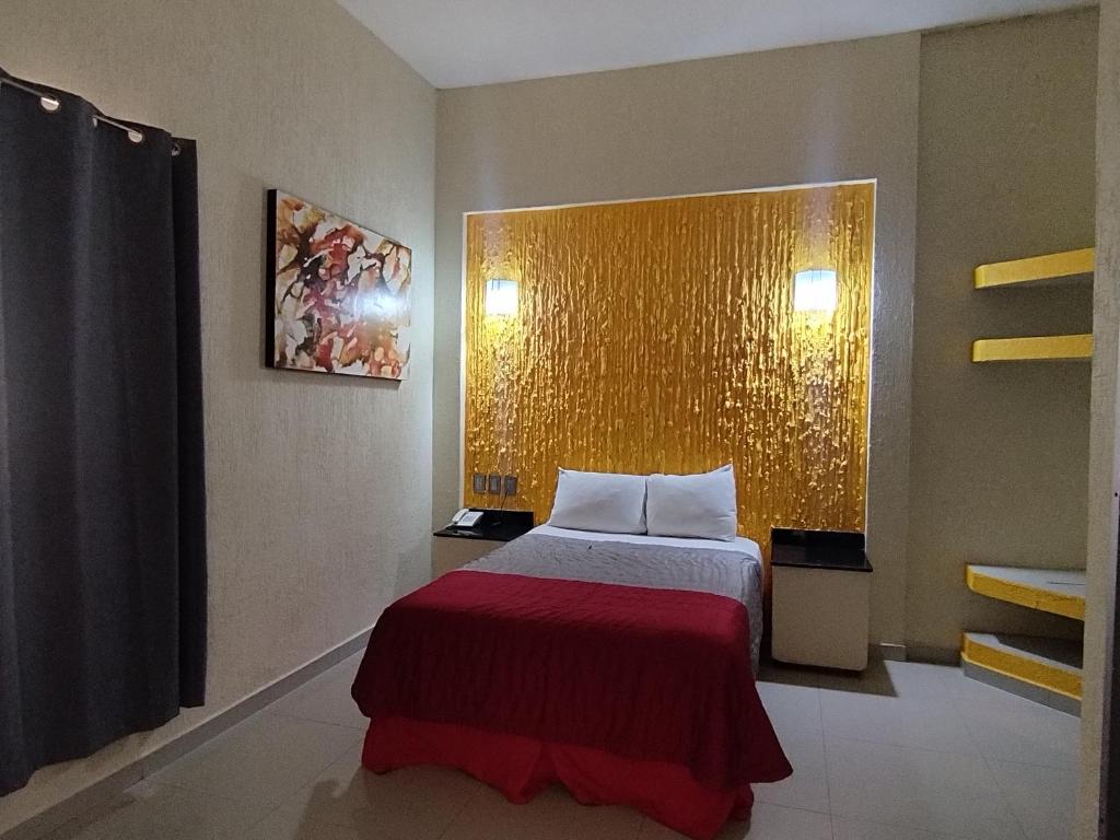 Postel nebo postele na pokoji v ubytování HOTEL MORELOS
