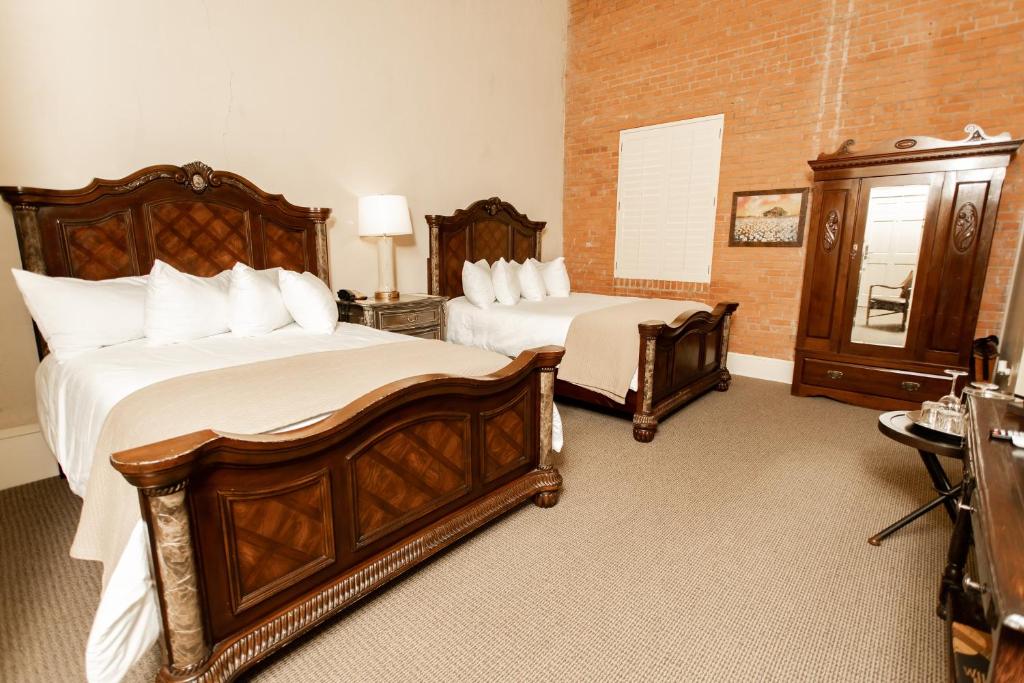Postel nebo postele na pokoji v ubytování Grand Hotel