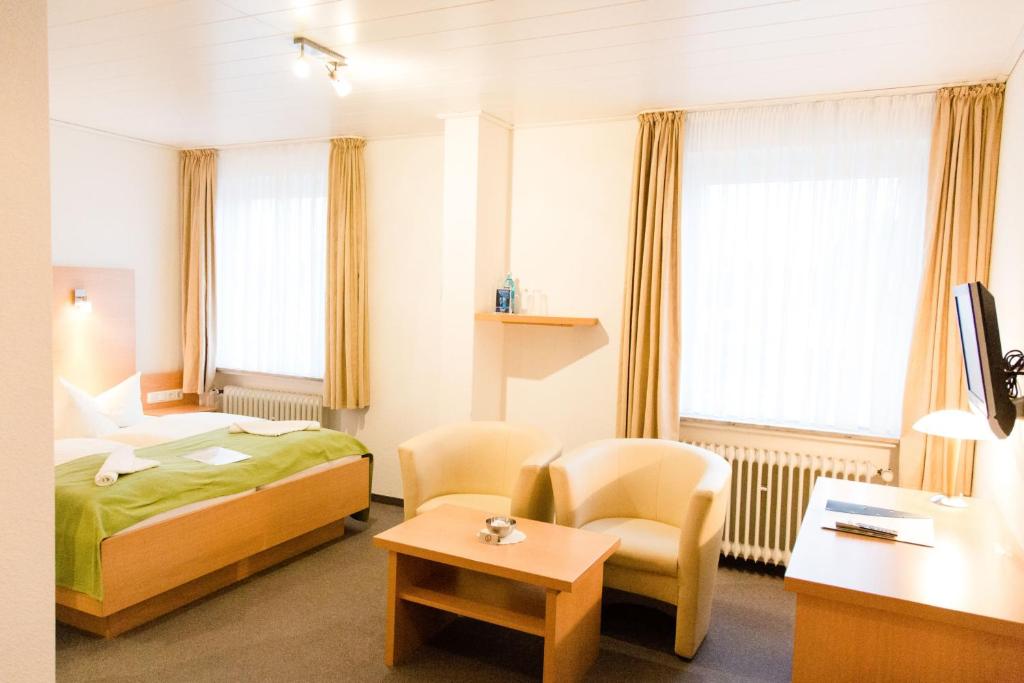 Postel nebo postele na pokoji v ubytování Friesen Hotel