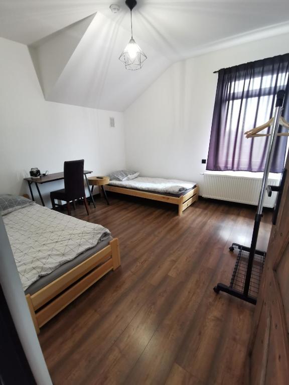 Postel nebo postele na pokoji v ubytování Stalowy Gościniec
