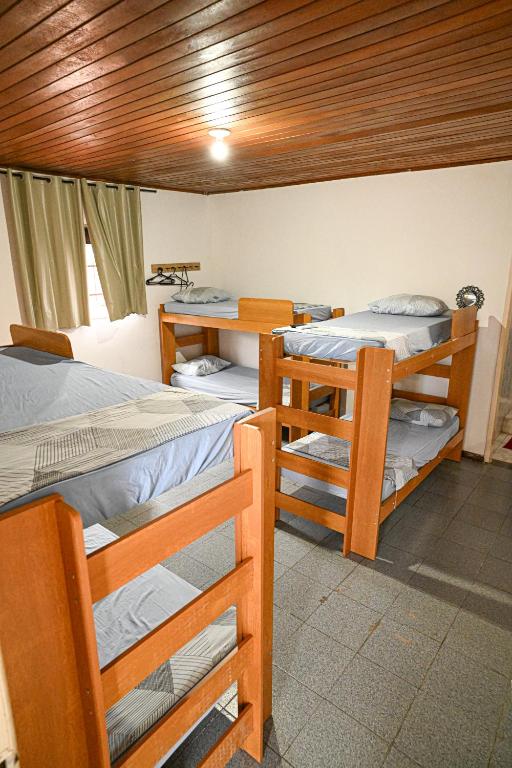 Postel nebo postele na pokoji v ubytování Hostel mineiros