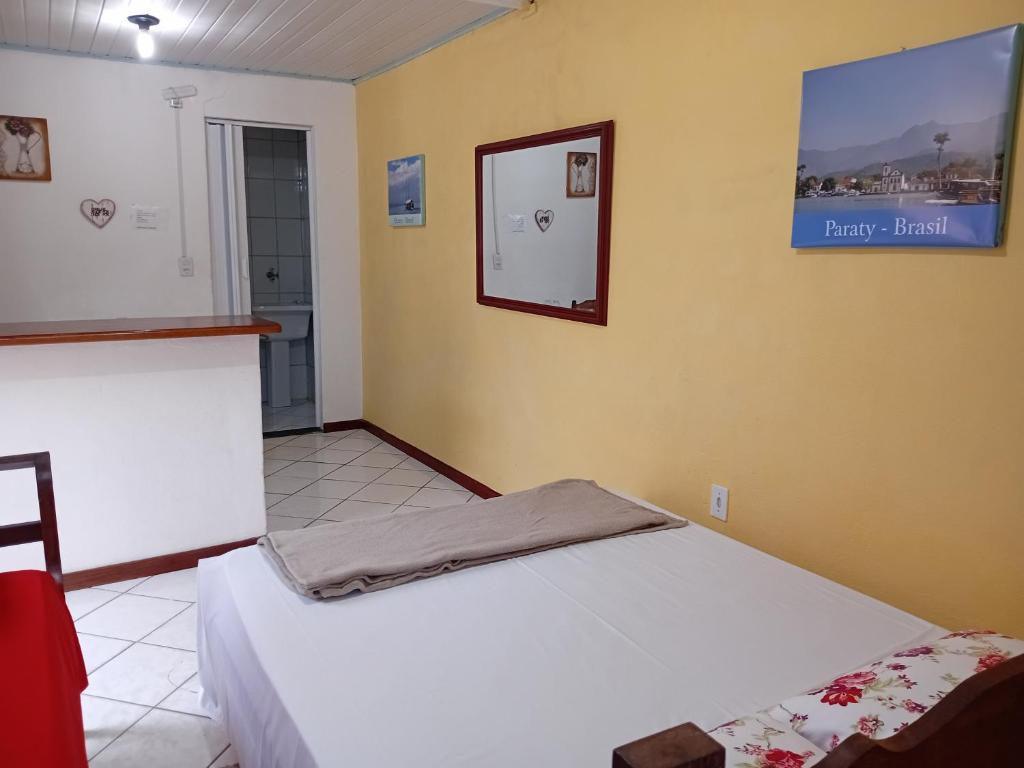 Postel nebo postele na pokoji v ubytování Hospedagem dona Alaide