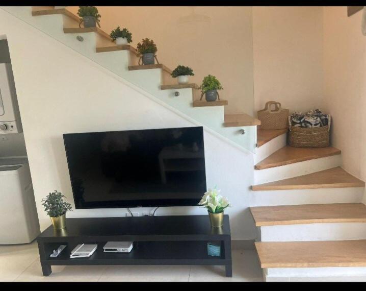 TV a/nebo společenská místnost v ubytování Flamingo Villa in Boca Paraiso