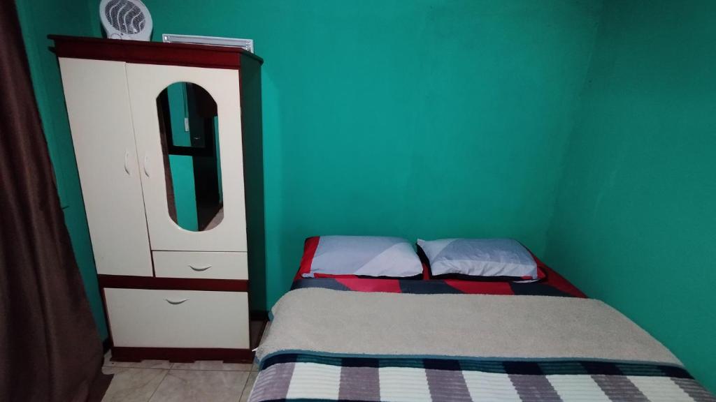 Postel nebo postele na pokoji v ubytování Cápsula 127