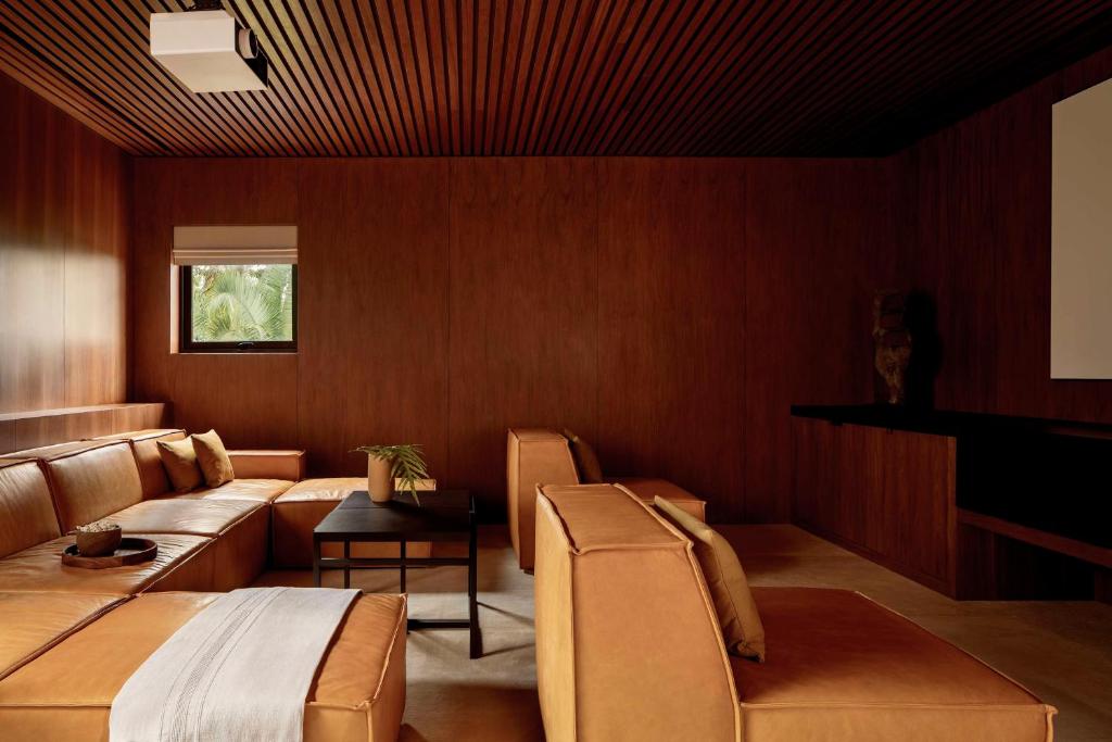 a living room with a couch and a table at One&Only Mandarina in Lo de Marcos