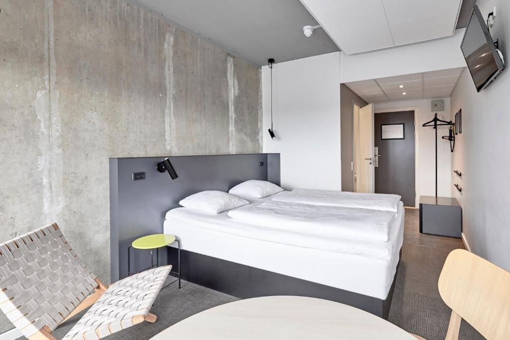 Una cama o camas en una habitación de Four Points Flex by Sheraton Aarhus Viby