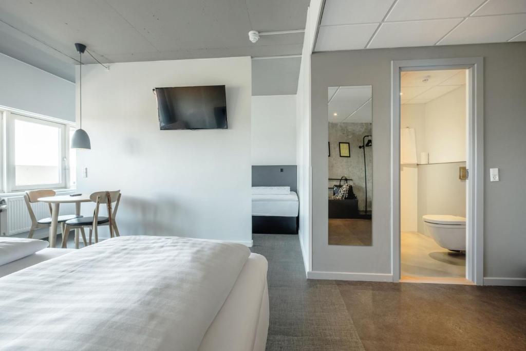 Una cama o camas en una habitación de Four Points Flex by Sheraton Aarhus Viby