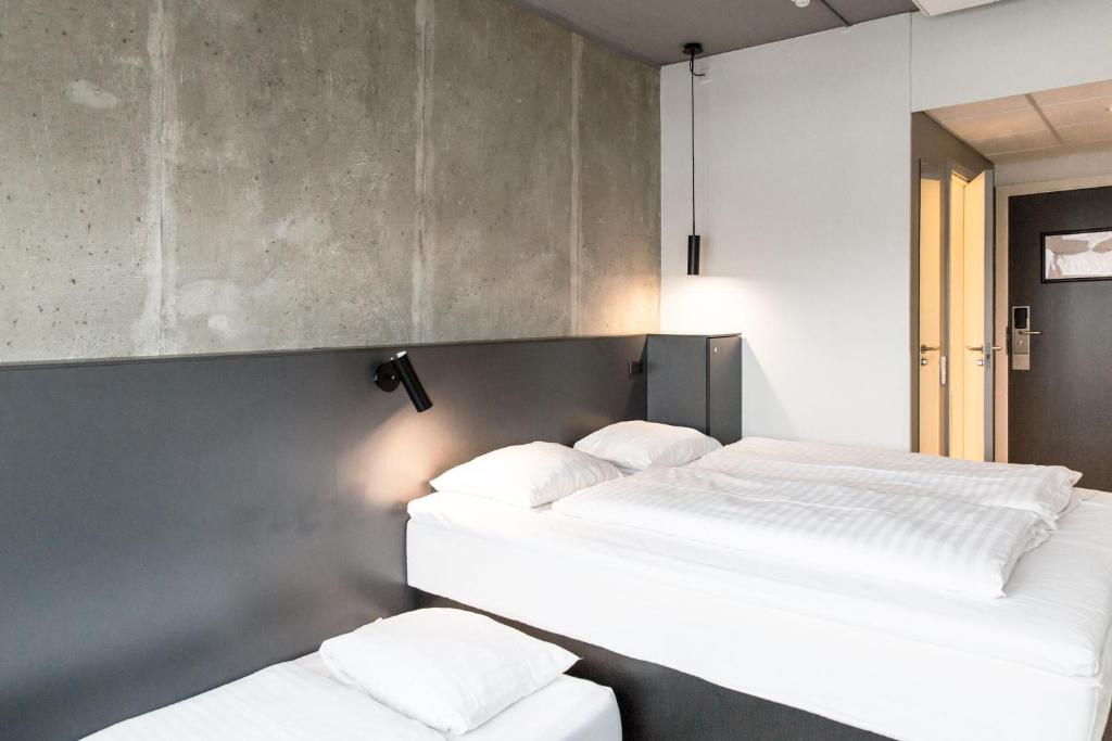 Una cama o camas en una habitación de Four Points Flex by Sheraton Aarhus Viby