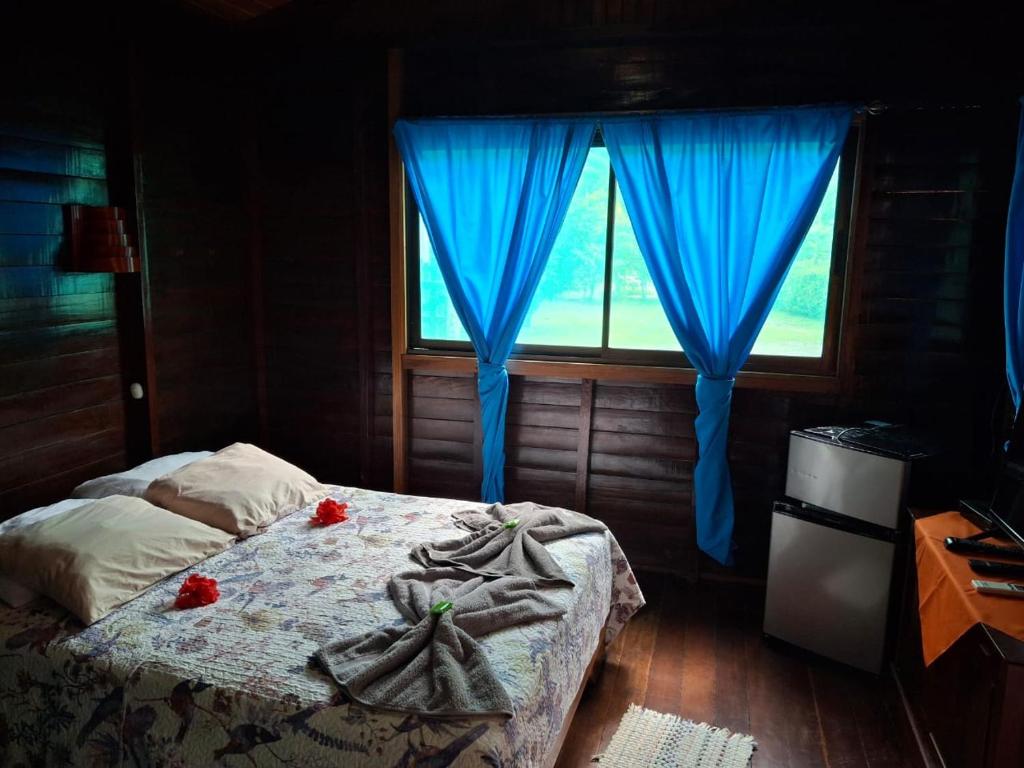 Postel nebo postele na pokoji v ubytování Cabinas Nirvana