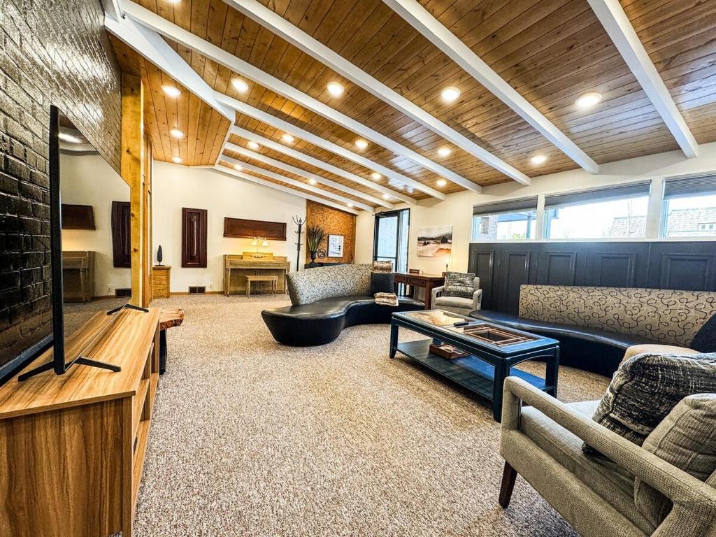 a living room with a couch and a tv at MY PLACE! Luxury 2 Bed with piano! in Willmar