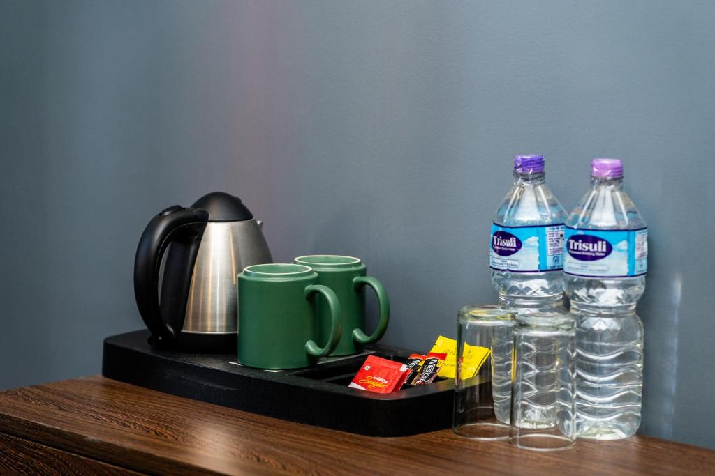 Příslušenství pro přípravu čaje a kávy v ubytování Hotel Yukhang