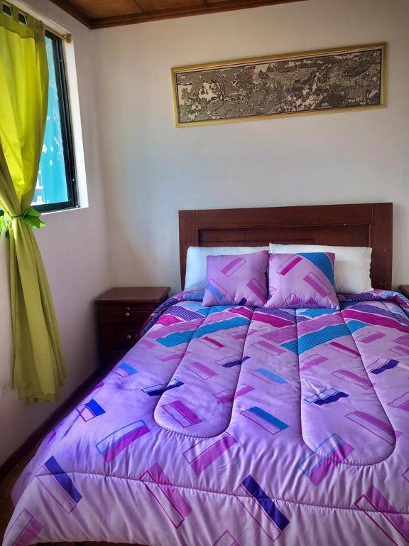 Postel nebo postele na pokoji v ubytování Hostal Café Tiana