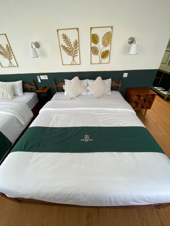 Postel nebo postele na pokoji v ubytování Agung Guest House by RF