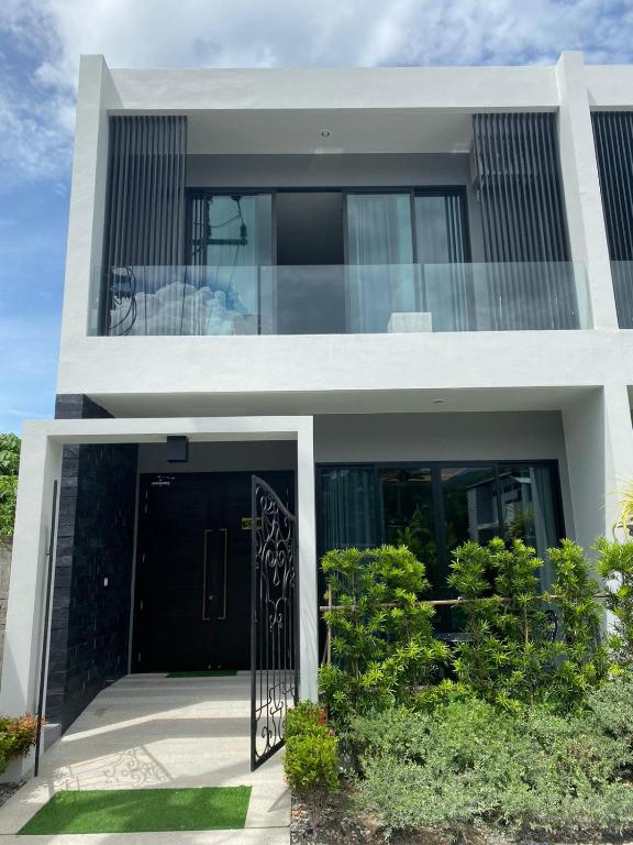 a modern house with a black door at villa kamala regent 2 bedrooms in Kamala Beach