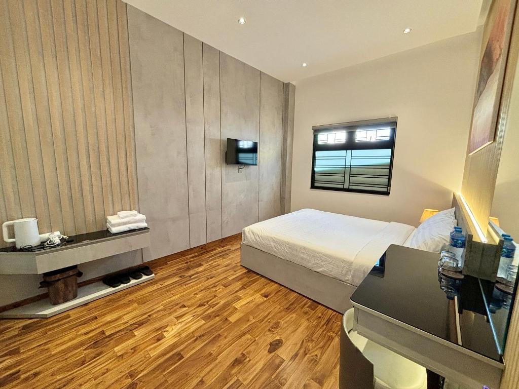 Postel nebo postele na pokoji v ubytování CEVA Hotel & Apartment Danang