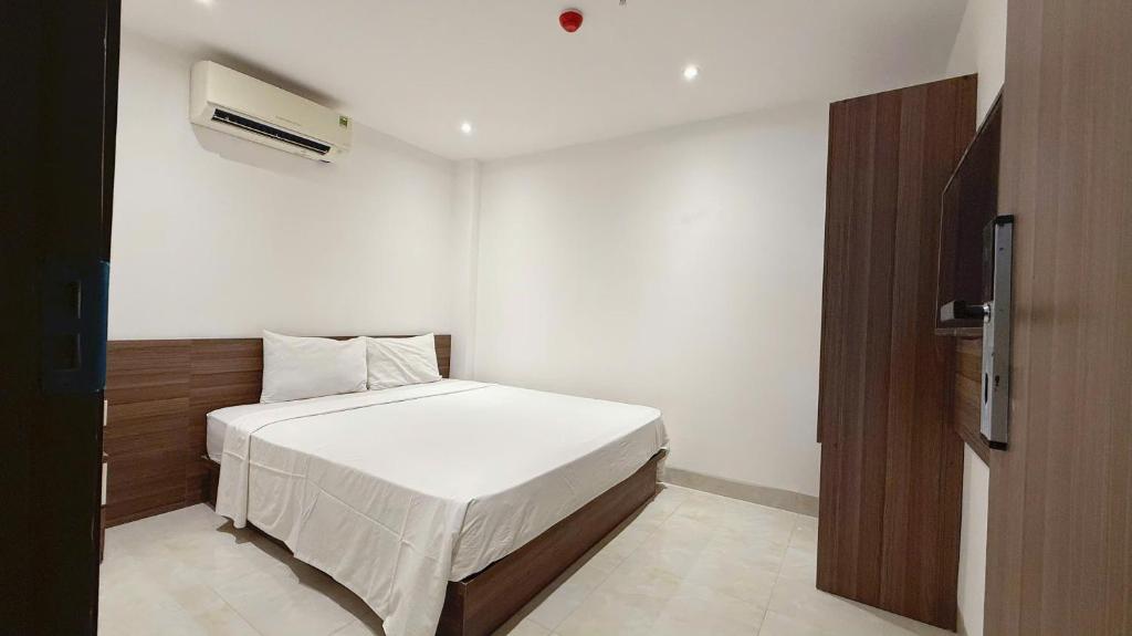 Giường trong phòng chung tại AQua Hotel & Spa