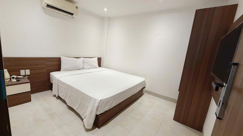 Giường trong phòng chung tại AQua Hotel & Spa