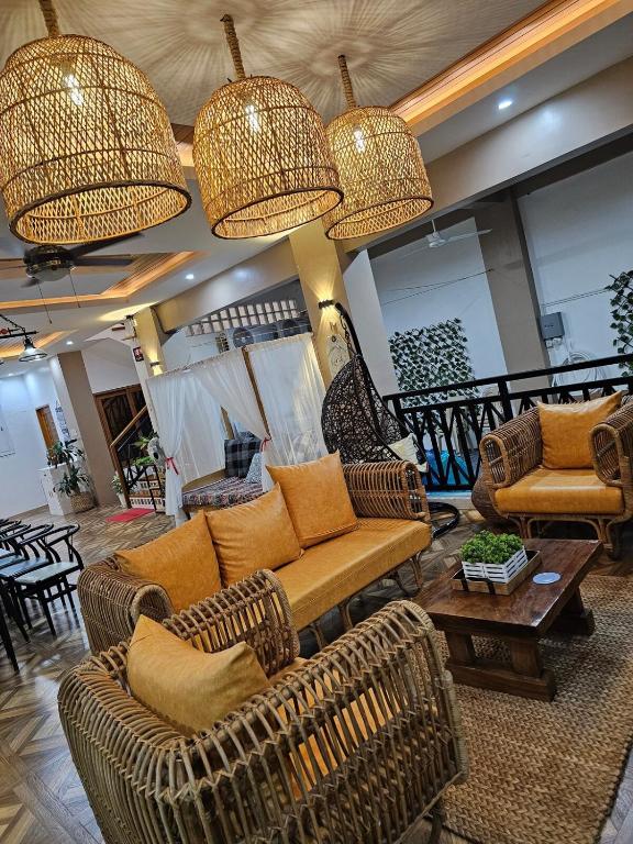 a living room with two couches and a table at Casa Amoris Uno in Los Baños