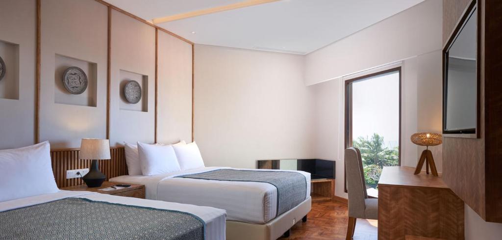 Postel nebo postele na pokoji v ubytování Grand Mirage Resort & Thalasso Bali