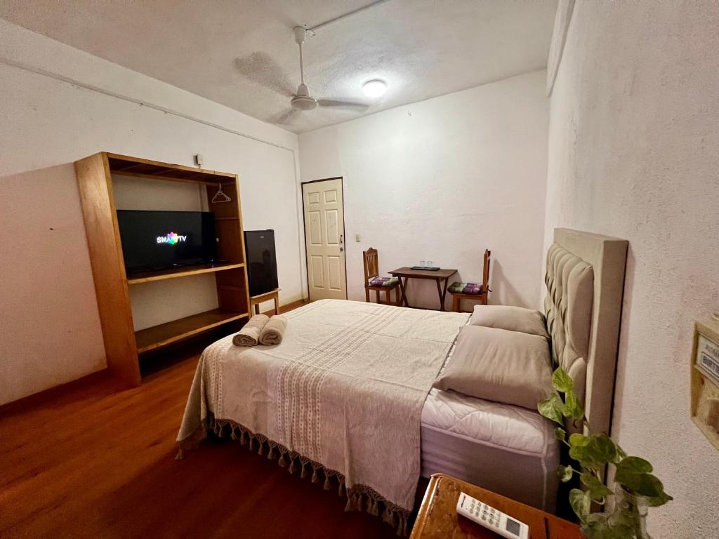 Letto o letti in una camera di Huitzilin Hostal