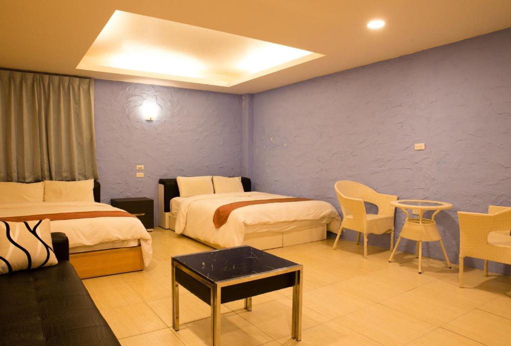 Postel nebo postele na pokoji v ubytování Dajenshan Hotel